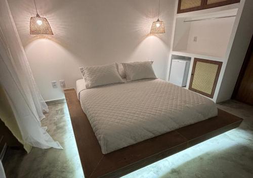 Ένα ή περισσότερα κρεβάτια σε δωμάτιο στο Villa Canoe Hotel