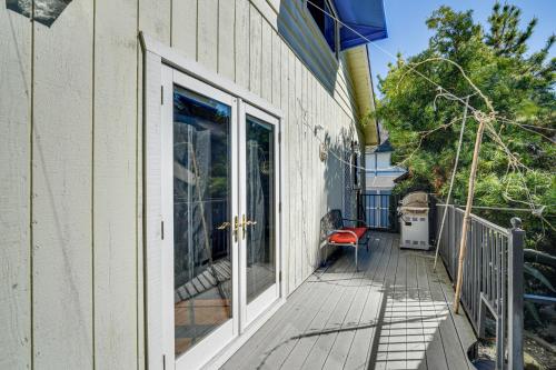 a porch with a door and a bench on a house at 6 Blocks to SJSU Cozy Bungalow with Deck and Koi Pond in San Jose