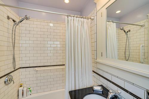 a bathroom with a toilet and a shower at 6 Blocks to SJSU Cozy Bungalow with Deck and Koi Pond in San Jose