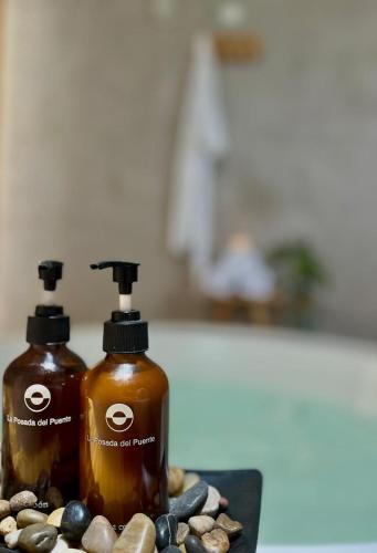 two bottles of soap sitting on top of a counter at La Posada del Puente in Arequipa