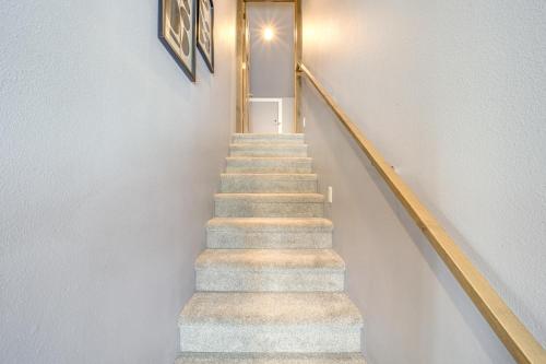 a staircase in a home with a stair case at Chelan Mountain Retreat Chalet with Fire Pit! in Chelan