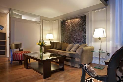 a living room with a couch and a table at San Telmo Suites in Buenos Aires