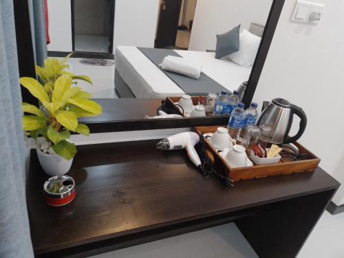 a tray of food on a table in a room at COCO Rooms in Galle