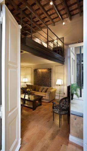 a living room with a loft bed and a couch at San Telmo Suites in Buenos Aires