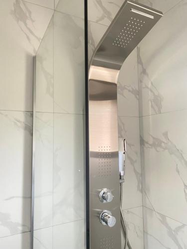 a shower with a glass door in a bathroom at Casa Lanardi, Stavros in Stavros