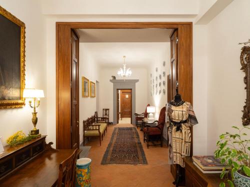 a hallway with a door open to a living room at Borgia di Firenze in Florence