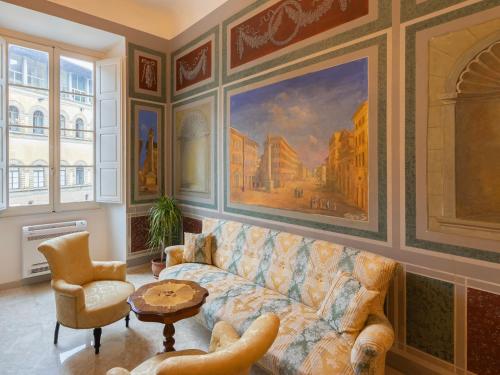a living room with a couch and a painting at Borgia di Firenze in Florence
