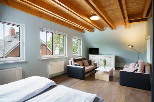 Ένα ή περισσότερα κρεβάτια σε δωμάτιο στο Ferienhaus CARPE DIEM in Gager WE 01 direkt am Bodden