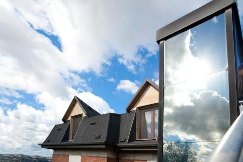 a house with a view of the sky through a window at Hotel Caselle in San Lazzaro di Savena