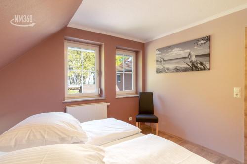 Postel nebo postele na pokoji v ubytování Traumhaftes Appartement - Odins Blick Wohnung 13 , Sauna und Privatstrand, Blick zur Ostsee