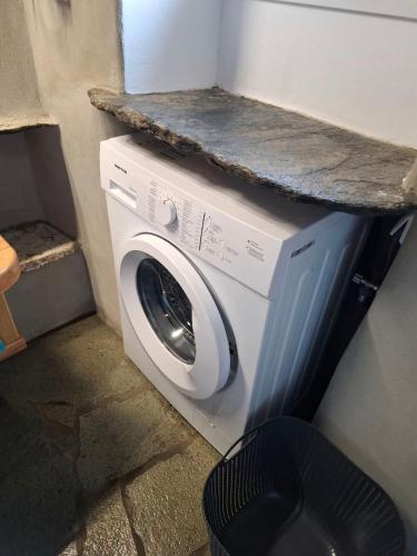 a washing machine with a counter on top of it at Sea Melody Tinos in Agios Sostis