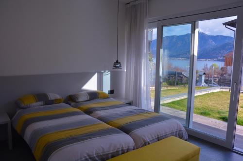 Ένα ή περισσότερα κρεβάτια σε δωμάτιο στο Villa Elisabetta