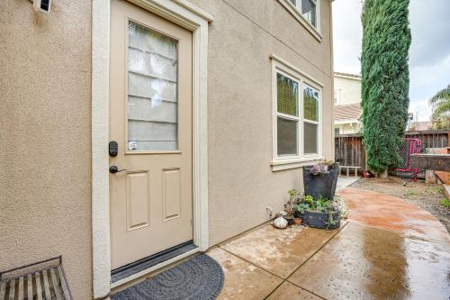 a door to a house with flowers in a pot at Pool and Hot Tub Access Extended Stay in Brentwood! in Brentwood