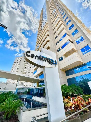 a large building with a sign in front of it at Flat completo com linda vista in Palmas