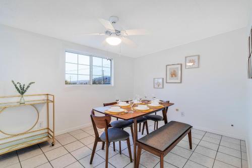 a dining room with a table and chairs at 6 Mi to Joshua Tree Home with Outdoor Oasis and View! in Twentynine Palms