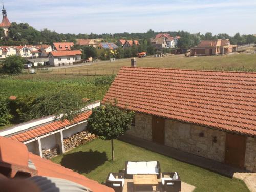 an aerial view of a house with an orange roof at Penzion V polích in Malé Číčovice