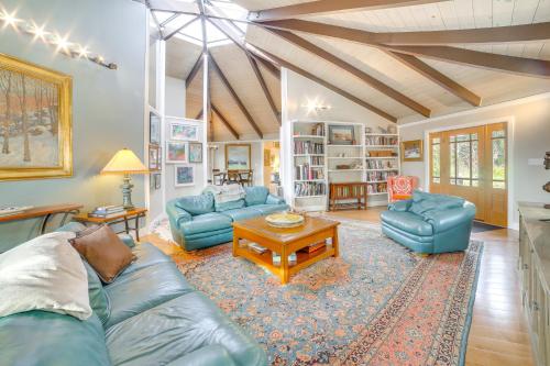 a living room with a blue couch and a table at Close to Beaches and Hiking Beautiful Aptos Abode in Aptos