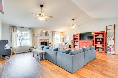 a living room with a couch and a fireplace at Lakefront Home with Private Dock in Grove in Grove