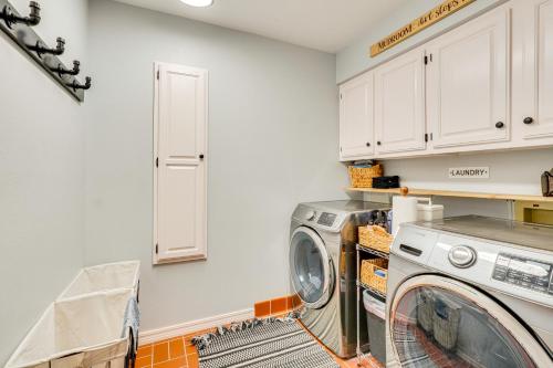 a laundry room with a washer and dryer at Lakefront Home with Private Dock in Grove in Grove