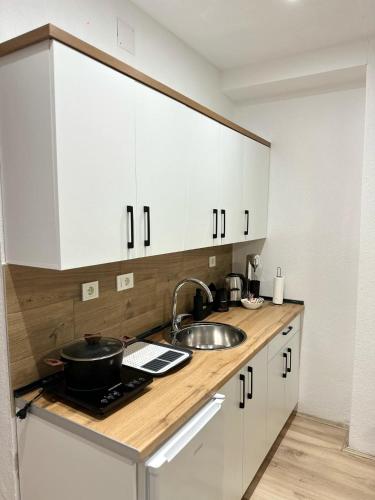 Η κουζίνα ή μικρή κουζίνα στο Kalinovi Apartments