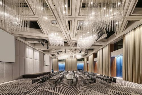 a rendering of a lobby with chandeliers and benches at W Taipei in Taipei