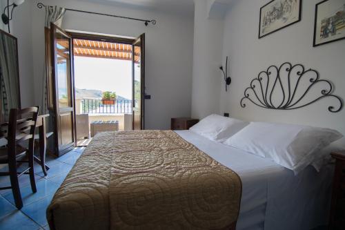 Postel nebo postele na pokoji v ubytování Hotel Corallo Sperlonga