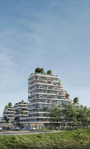 a tall building with trees on top of it at Ti Malo - studio proche plage Dunkerque in Dunkerque