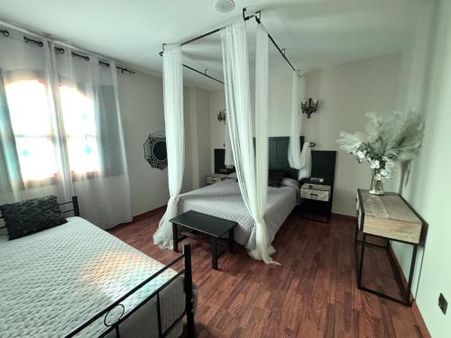 a bedroom with a bed with a canopy at Hotel Castillo Bonavía in Pedrola