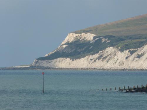 a large body of water with a mountain in the background at The Iverna in Eastbourne