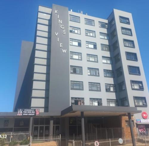 a large building with a sign on the front of it at Kingsview 201 in Margate