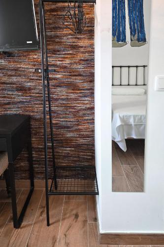 a door leading into a room with a mirror at Fabrica de Harina in Ventas con Peña Aguilera