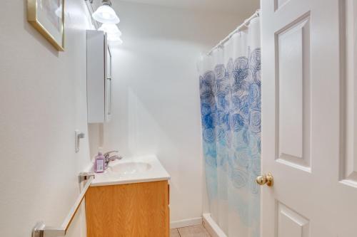 a bathroom with a sink and a shower at 1 Block to Twin Rocks Beach Pet-Friendly Cottage in Rockaway Beach