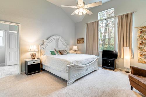 a bedroom with a bed and a ceiling fan at Hot Tub, Fire Pit Retreat in The Woodlands! in The Woodlands