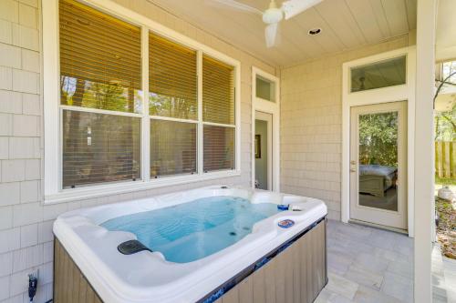 a jacuzzi tub in a room with windows at Hot Tub, Fire Pit Retreat in The Woodlands! in The Woodlands