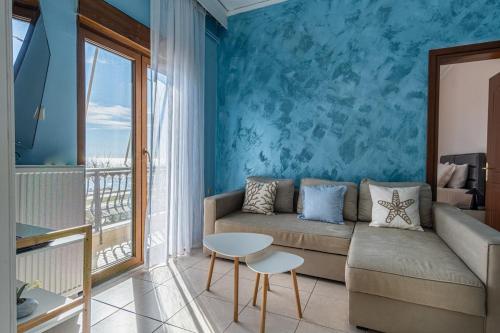 a living room with a couch and a table at Vitamine Sea in Alexandroupoli