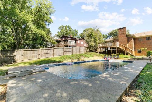 a pool in the backyard of a house at Two Kitchens Family Friendly in Forestdale in Birmingham
