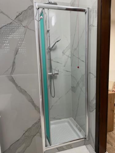 a shower with a glass door in a bathroom at Ca Aisha Train Station Venice in Mestre