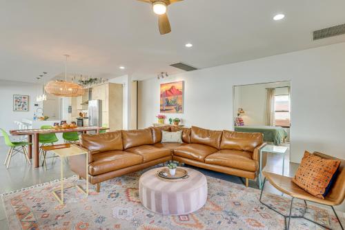 a living room with a couch and a table at Backyard Oasis with Pool! Family Getaway in Phoenix in Phoenix