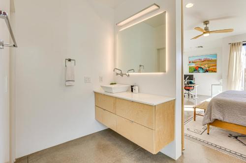 a bathroom with a sink and a mirror at Families Welcome Phoenix Home with Backyard Oasis in Phoenix