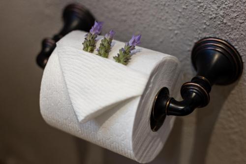 a roll of toilet paper with purple flowers on it at Artesana - Privately Owned Rosewood Residence in San Miguel de Allende