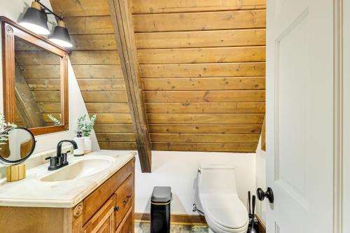 a bathroom with a sink and a toilet at Hot Tub, Fire Pit and Patio A-Frame Stafford Cabin in Stafford