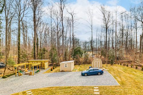 a car parked in a parking lot next to a playground at Hot Tub, Fire Pit and Patio A-Frame Stafford Cabin in Stafford