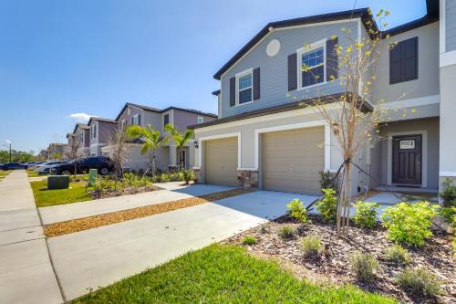 a house with a driveway and a garage at 6 Mi to Apollo Beach Townhome with Pool Access! in Ruskin