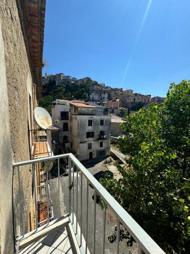an apartment balcony with a view of a city at Mare Apartment 4 in Scalea