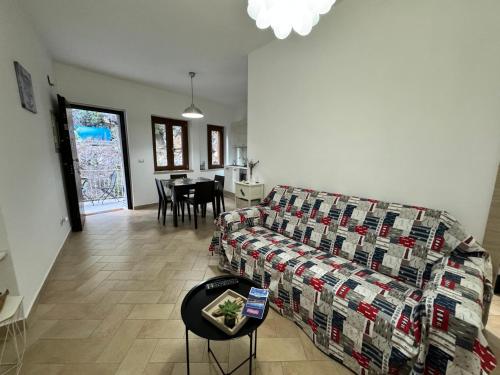 a living room with a couch and a table at Mare Apartment 4 in Scalea