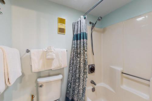 a bathroom with a shower and a toilet at Plantation Dunes #5404 in Gulf Highlands