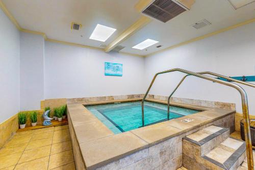 a large indoor swimming pool in a room at Plantation Dunes #5404 in Gulf Highlands