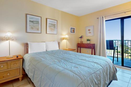 Ένα ή περισσότερα κρεβάτια σε δωμάτιο στο Plantation Dunes #5414