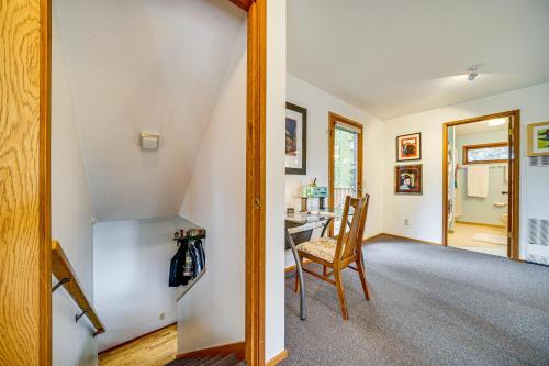 a dining room with a table and a chair at 2 Mi to Burien Peaceful Studio with Deck! in Burien