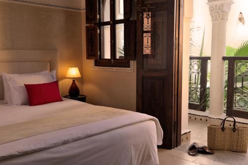 Cama o camas de una habitación en Riad Le Jardin d'Abdou